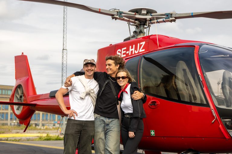 1 stockholm group in front of helicopter
